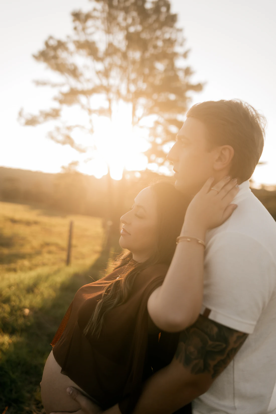 A couple embracing in late sun