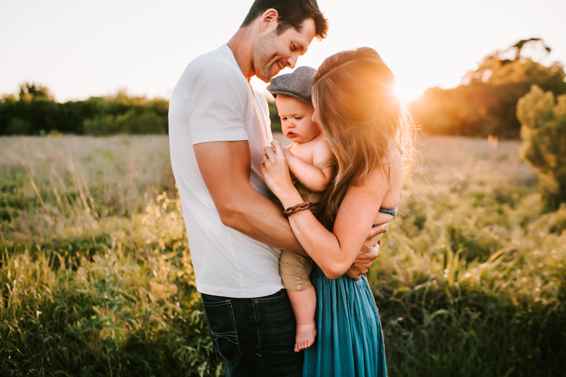 A family in a meadow at golden hour